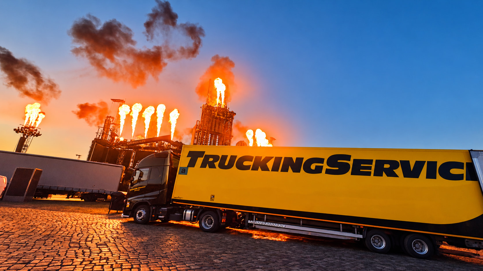 Trucking Service trailer in front of a concert stage with pyrotechnics